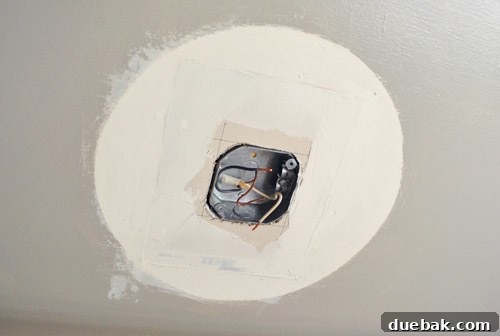Upgrade Your Boob Light to a Modern Pendant 13 First layer of spackle applied to the ceiling patch, drying.