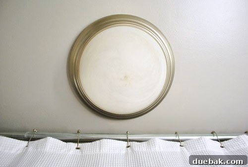 Upgrade Your Boob Light to a Modern Pendant 4 Bathroom corner showing the old flush mount light fixture close to the shower bar.