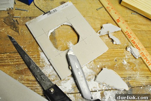Upgrade Your Boob Light to a Modern Pendant 9 Drywall patch with a circular hole cut for the electrical box.