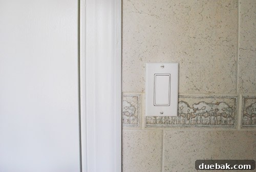 Bathroom Glow-Up on a Budget 12 The bathroom door and trim completely painted in bright white, matching the other white elements.
