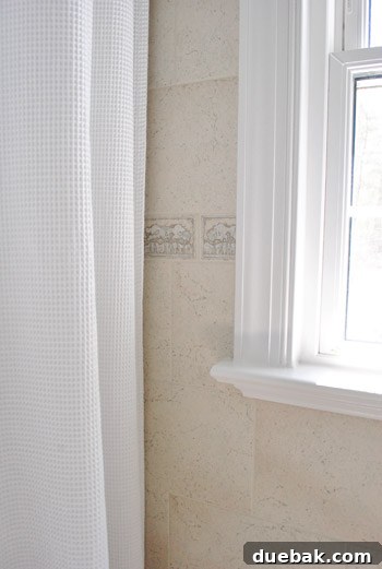 Bathroom Glow-Up on a Budget 13 Close-up of the bathroom window with its newly painted crisp white trim, looking fresh and clean.