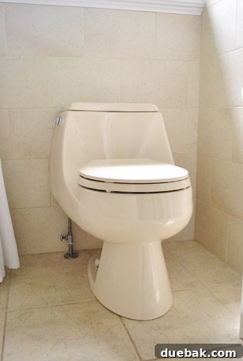 Old almond toilet in a bathroom