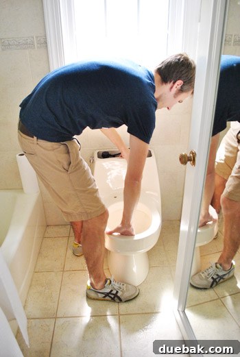 Old almond toilet being removed