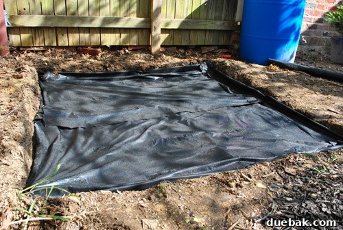 Securing weed block with garden staples