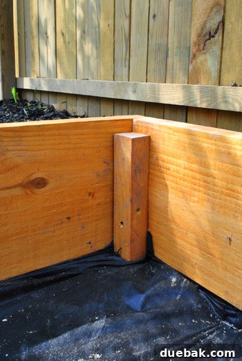 Installing corner stakes for sandbox