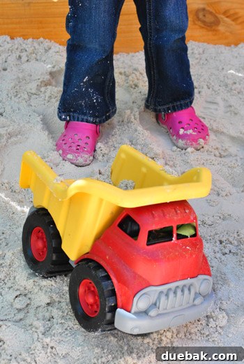 Clara playing in her new sandbox - sneak peek