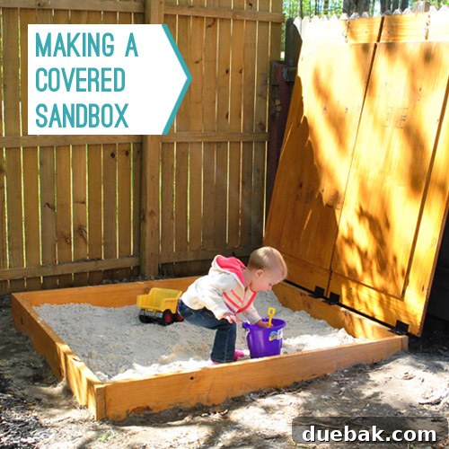 Full view of the completed sandbox with Clara playing inside