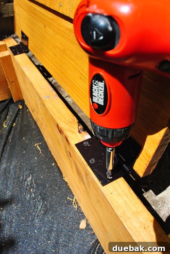 Hinge attached to the sandbox frame, ready for the cover