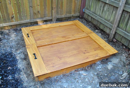 Sandbox cover at sunset, showing how it rests on the frame