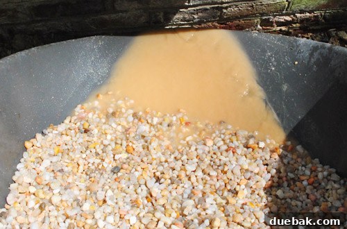Clean pea gravel filling the sandbox