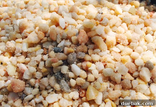 Washing pea gravel in a wheelbarrow