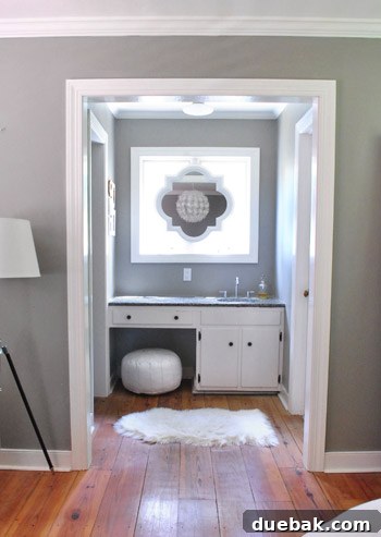 Our elegant quatrefoil mirror mounted above the sink in the main bedroom