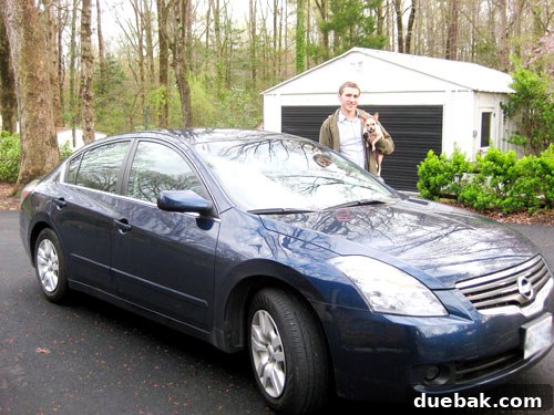 14 Brilliant Budget Hacks to Cut Costs and Grow Your Savings 2 Single car parked in a driveway, symbolizing one-car household savings