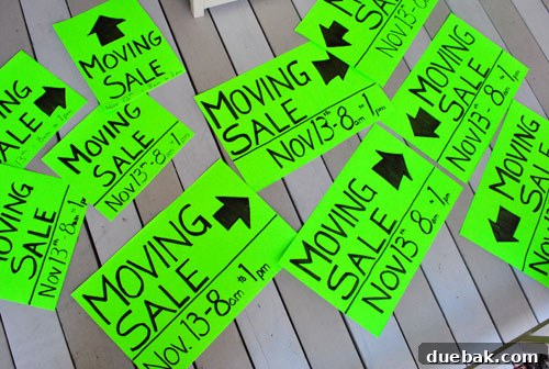 14 Brilliant Budget Hacks to Cut Costs and Grow Your Savings 4 A garage sale setup with various items for sale