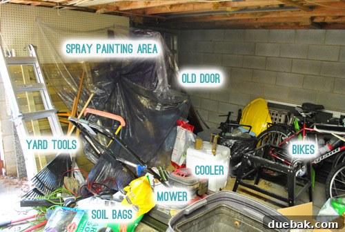 A workbench buried under tools, materials, and sawdust, highlighting the disorganization.