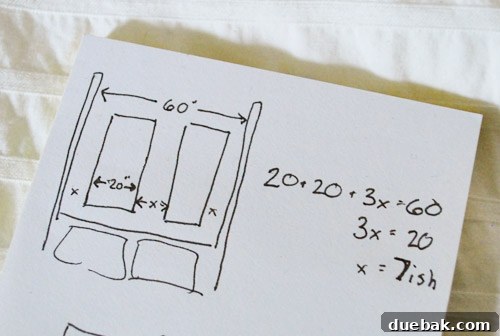 A handwritten sketch on a notepad showing mathematical calculations for measuring picture frame spacing on a wall.