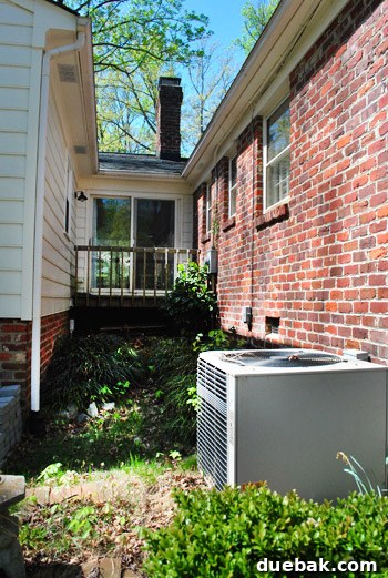 View down the alley from the house, showing the potential for a deck and the nearby kitchen access.
