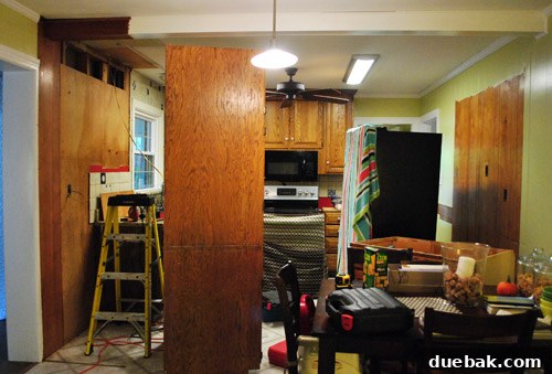 Mid-renovation kitchen with exposed framing and electrical