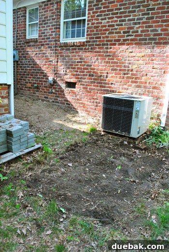 Area mostly clear of weeds, ready for deck construction