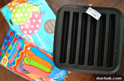 Earthworm Extravaganza Birthday 8 Ikea ice tray, highlighted by a pink arrow, intended for making worm-shaped ice or jello for the party.