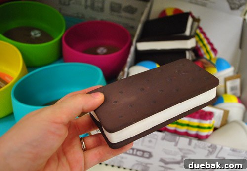 Dog toys, including an ice cream sandwich design, and colorful dog bowls, from Target's pet section.