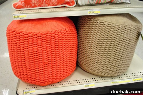 Privet House poufs in coral and neutral tones, resembling high-end designer pieces from West Elm or CB2.