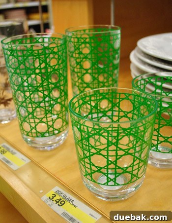 Green geometric patterned glasses, offering an alternative stylish option to the coral design.