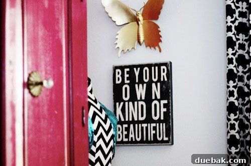 Bold magenta armoire providing functional storage in a cheerful girls bedroom