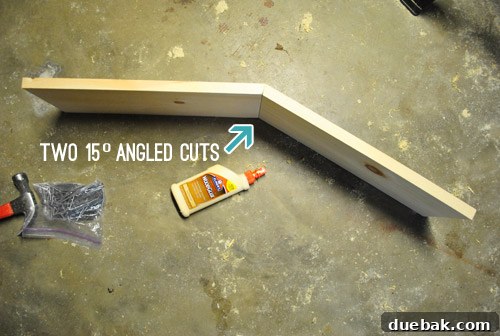 Two pieces of wood glued together to form the dollhouse roof peak