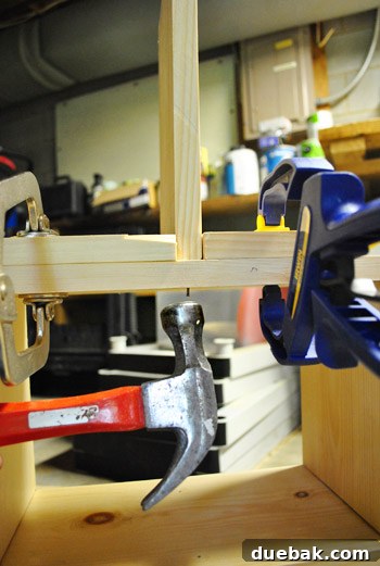 Installing the central support wall for the dollhouse roof
