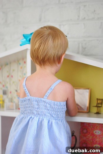 Close-up of the completed dollhouse structure, ready for decoration
