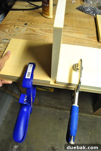 Clamping wood pieces for dollhouse wall assembly, using scrap wood for support