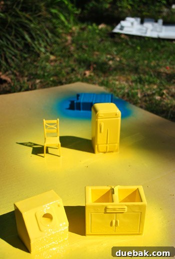 Pint-Sized Palaces: Decorating Your Dollhouse 11 Small Dollhouse Furniture Spray Painted Sun Yellow and Blue Lagoon On Cardboard