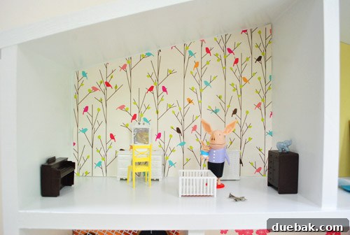 Pint-Sized Palaces: Decorating Your Dollhouse 15 Detail Of Dollhouse Room With Olivia The Pig Dolls And Bird Wallpaper