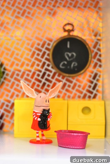 Pint-Sized Palaces: Decorating Your Dollhouse 19 Close Up Of Chalkboard Wall Hanging In Dollhouse With Daughters Initials