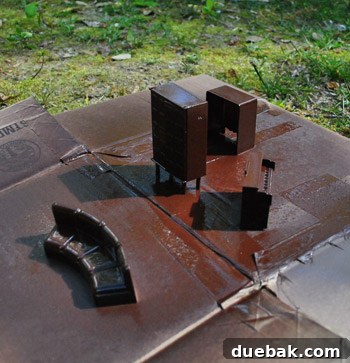 Pint-Sized Palaces: Decorating Your Dollhouse 9 Small Dollhouse Furniture Spray Painted Brown On Cardboard