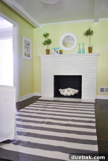 Close-up of the gray and white striped rug, revealing its visual impact