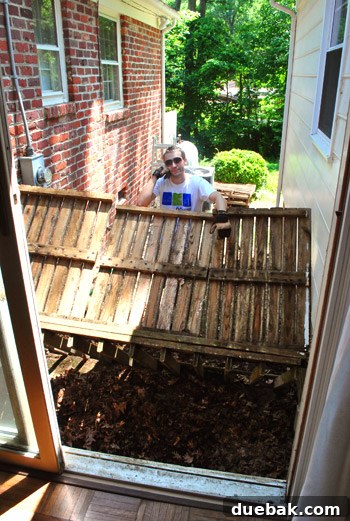 Reclaiming Space: From Balcony to Spacious Deck 5 The underside of the detached balcony floor, with the old railing now lying on the ground