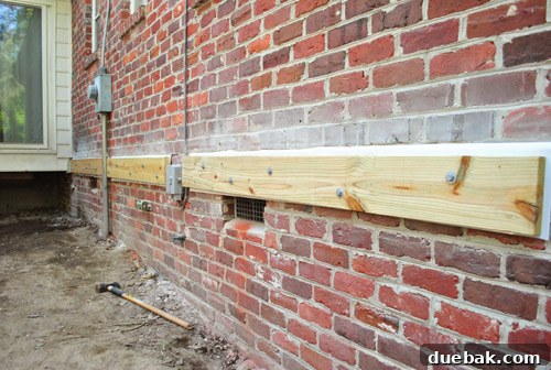 Sourcing Your Deck Building Materials 17 Completed ledger board section on the brick side