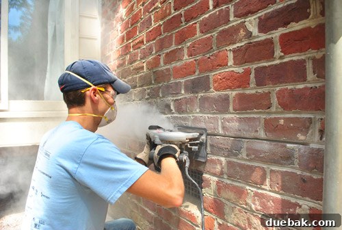 Sourcing Your Deck Building Materials 6 Cutting a trench into the mortar joint for flashing
