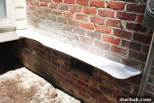 Sourcing Your Deck Building Materials 9 First piece of flashing installed on the brick wall