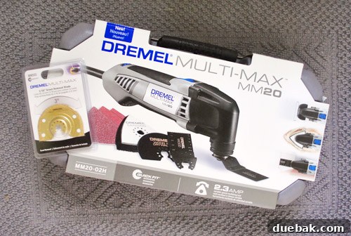 The Dremel Multi-Max oscillating tool with a specialized grout removal attachment, ready for use