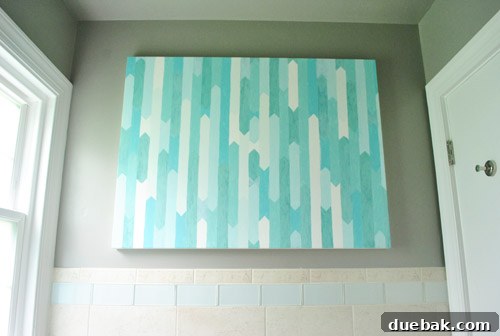Comparison of the new, clean glass tile border with the previous busy tree pattern
