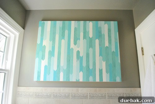 Full view of the updated bathroom with the new glass tile border, highlighting its aesthetic impact