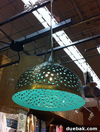 Tin pendant light with bronze exterior and turquoise interior