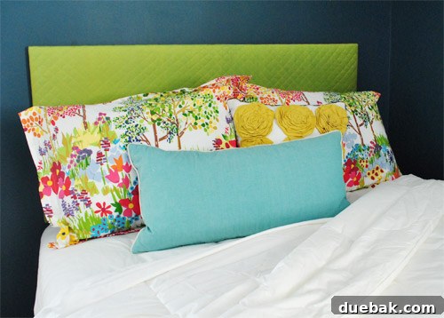 A guest bedroom photo used as a canvas for design mockups in Photoshop