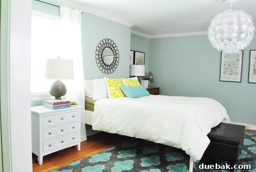 Wider view of the bedroom: Ed the bed after trimming, with future plans for large art and an upholstered headboard.