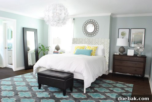 Concept rendering: Ed the bed with a proposed large fabric headboard and a higher-placed mirror.