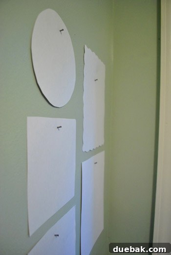 Every Year, A New Frame 12 Close-up of a nail hammered into the wall, guided by a paper template