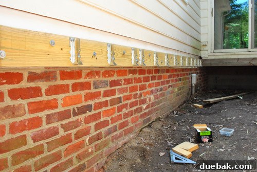 Illustrating the option to lower the deck to connect to the masonry foundation